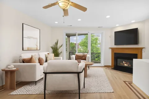 a living room with furniture fireplace and a flat screen tv