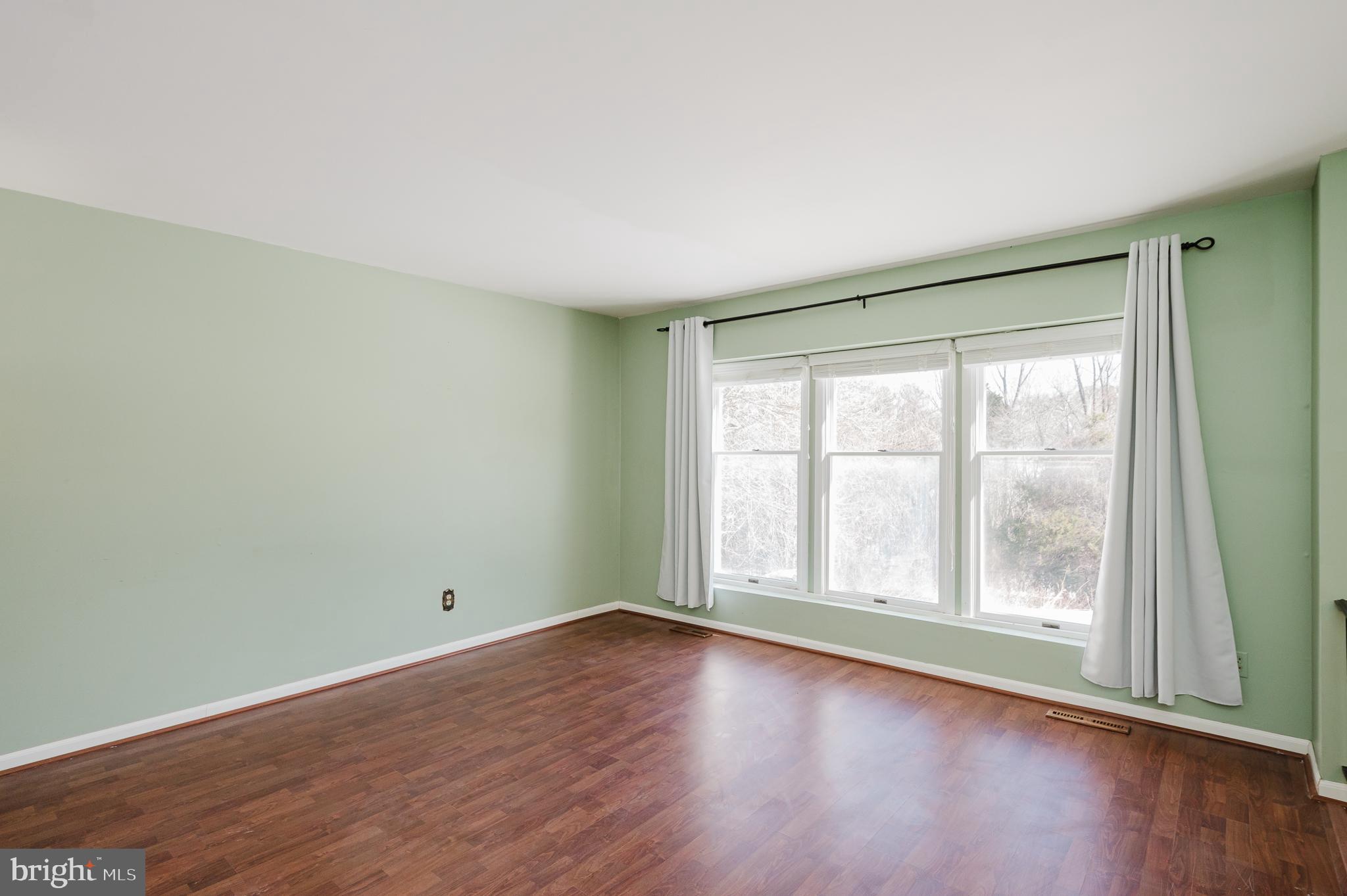 2804 Rocks Road Jarrettsville, MD 21084 - Photo 12 of 46 an empty room with wooden floor and windows
