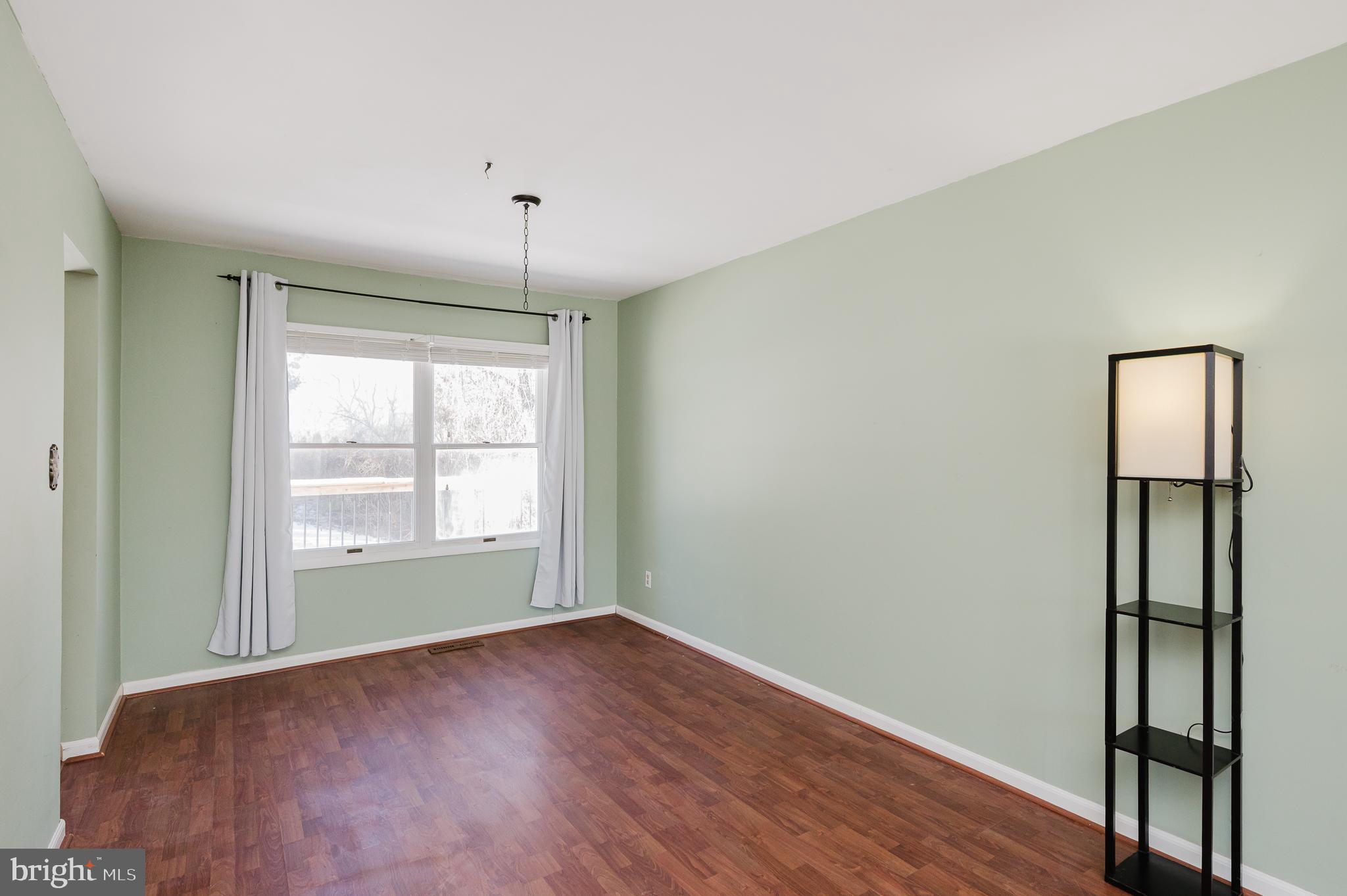 2804 Rocks Road Jarrettsville, MD 21084 - Photo 16 of 46 an empty room with wooden floor and windows