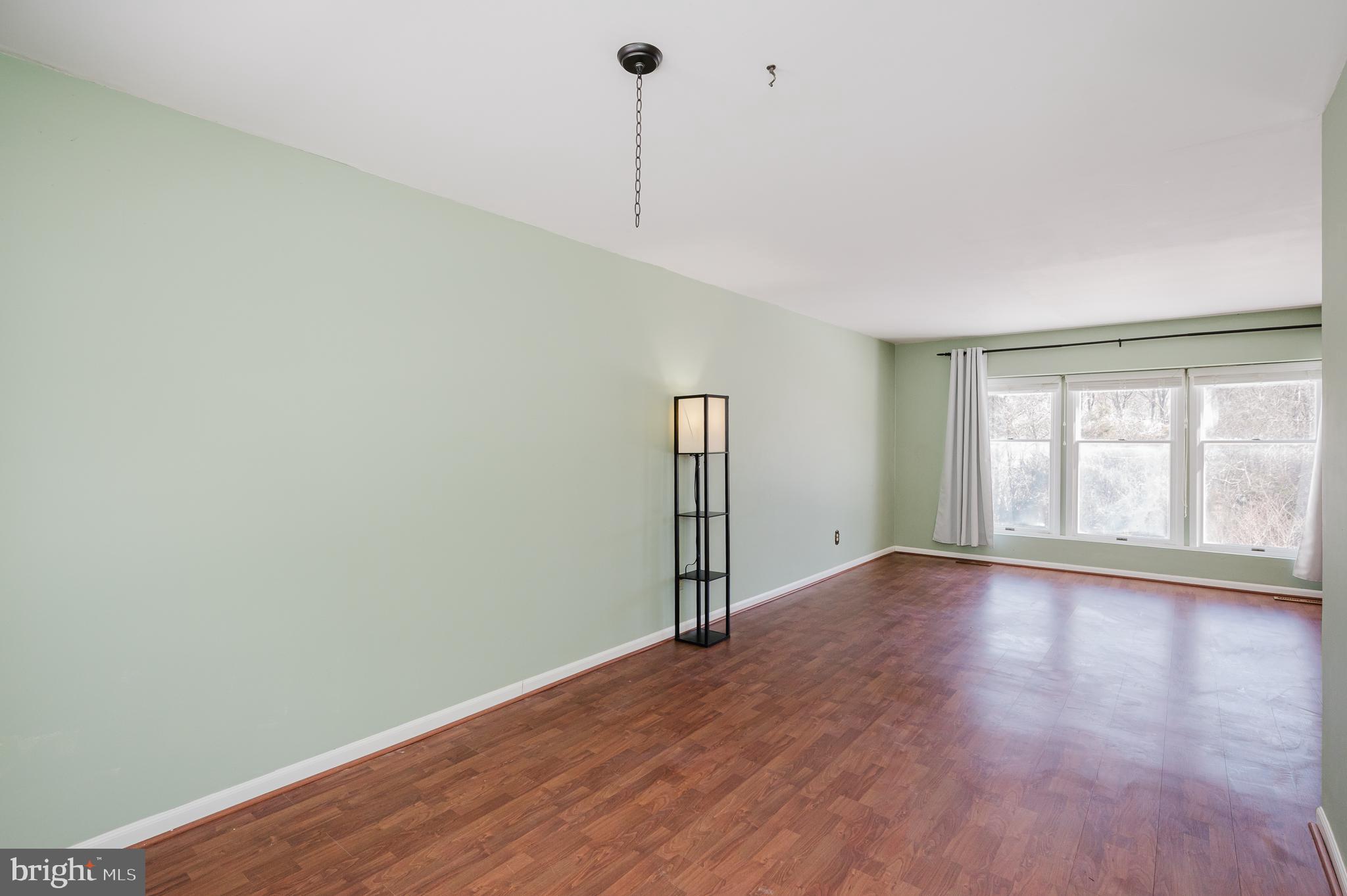 2804 Rocks Road Jarrettsville, MD 21084 - Photo 19 of 46 a view of an empty room with wooden floor and a window