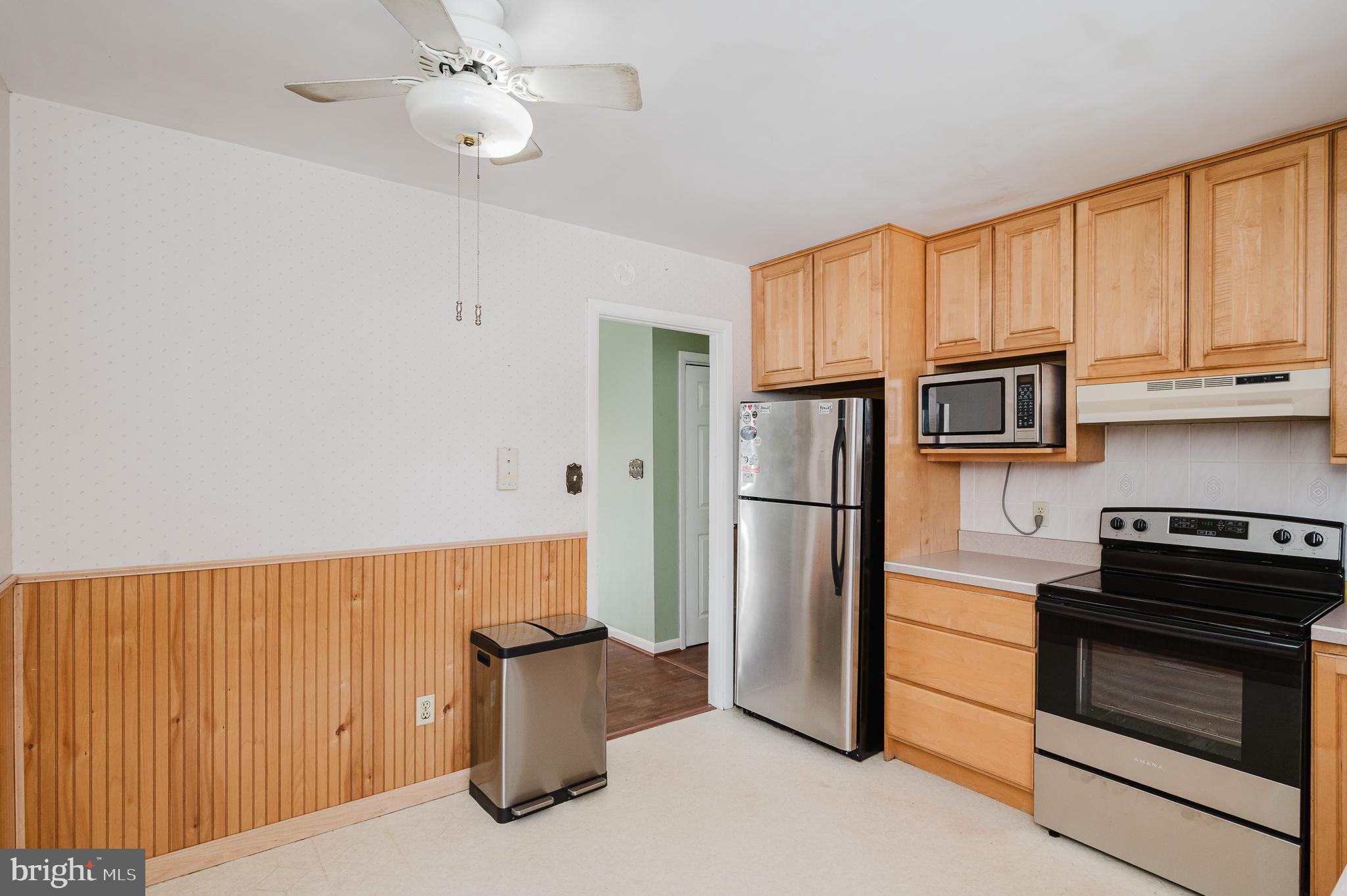 2804 Rocks Road Jarrettsville, MD 21084 - Photo 23 of 46 a kitchen with stainless steel appliances granite countertop a refrigerator oven stove a sink dishwasher and a microwave oven with cabinets