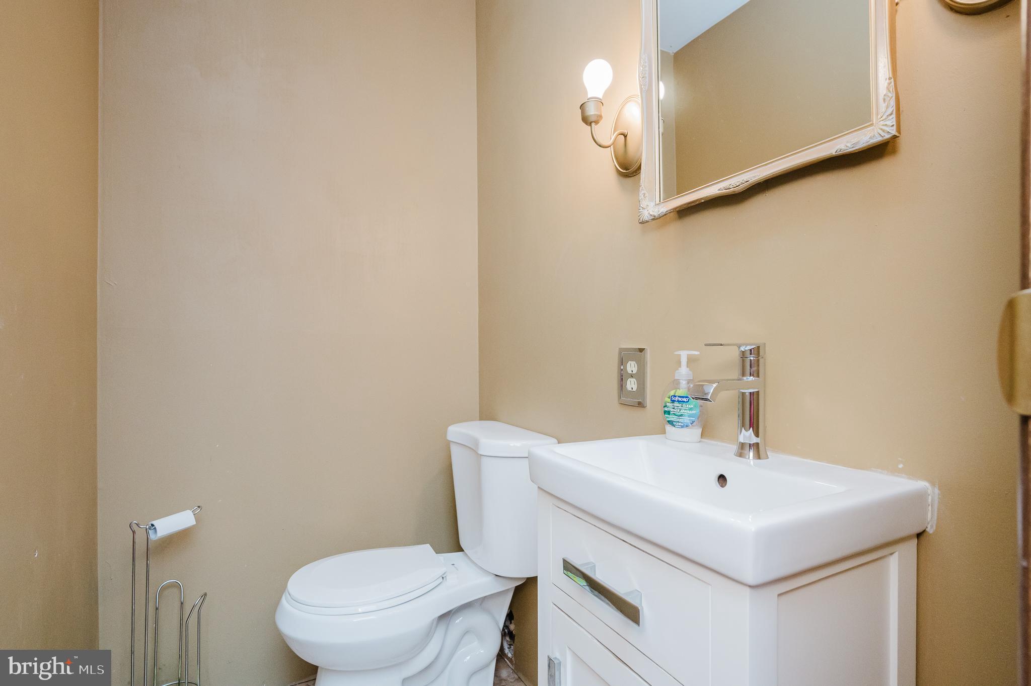 2804 Rocks Road Jarrettsville, MD 21084 - Photo 28 of 46 a bathroom with a sink a toilet and mirror