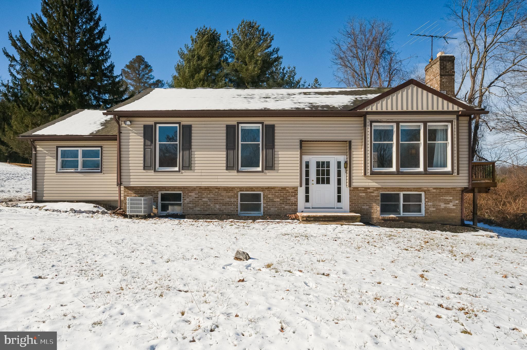 2804 Rocks Road Jarrettsville, MD 21084 - Photo 5 of 46 a front view of a house with a yard