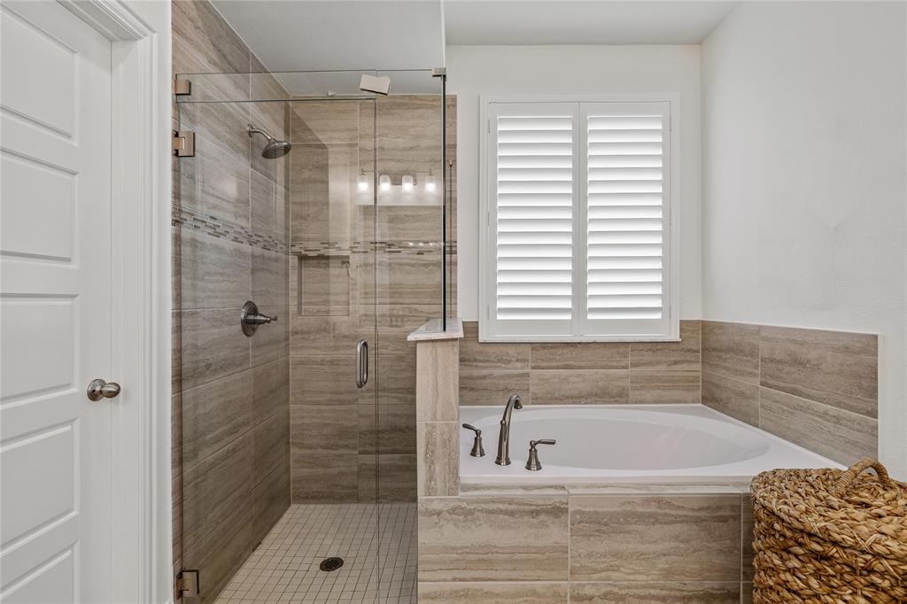 1430 Shaker Hills Road Gunter, TX 75058 - Photo 17 of 32 a bathroom with a shower and a bathtub