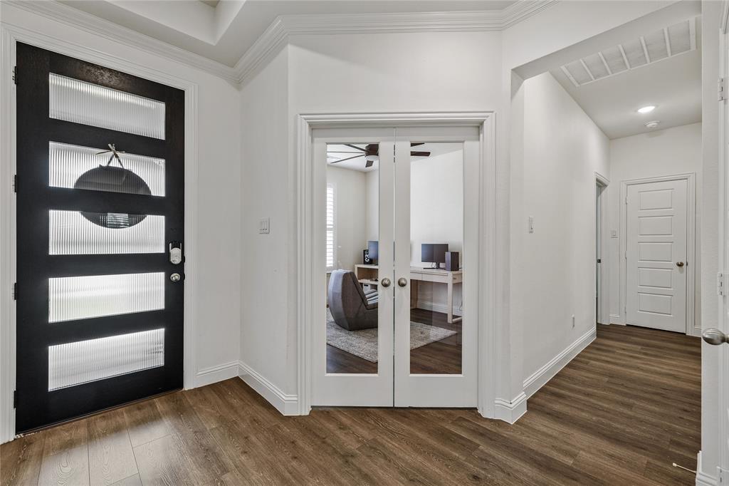 1430 Shaker Hills Road Gunter, TX 75058 - Photo 18 of 32 a view of a closet area with bedroom