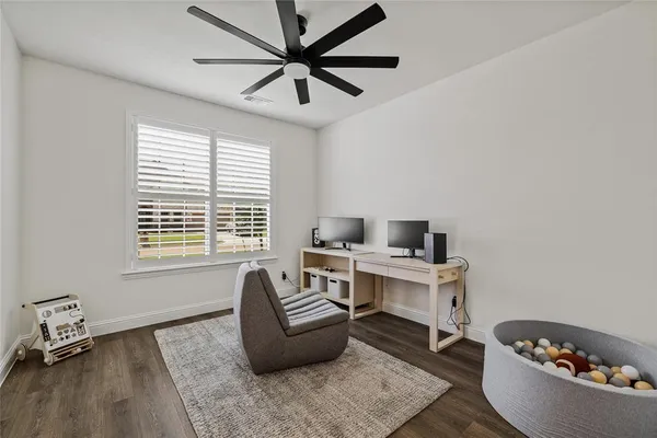 a workspace with furniture and a window