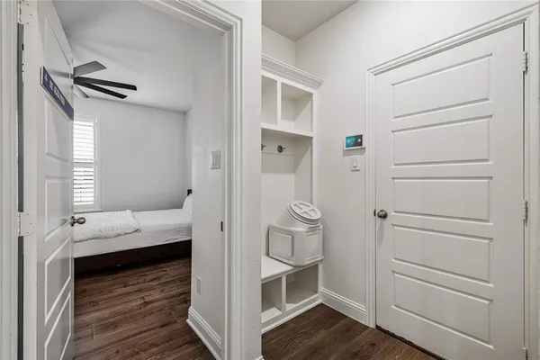 a large bed sitting in a bedroom next to a window