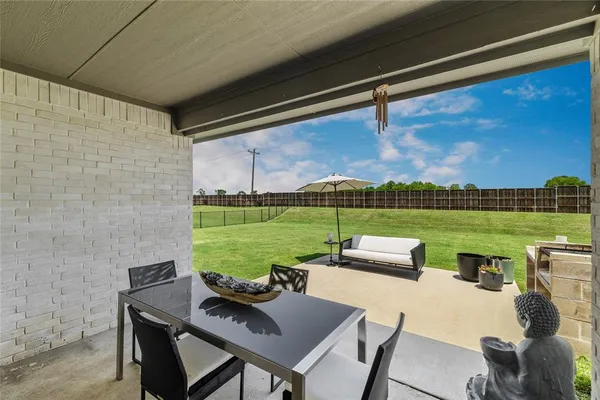 a outdoor space with patio furniture and a potted plant