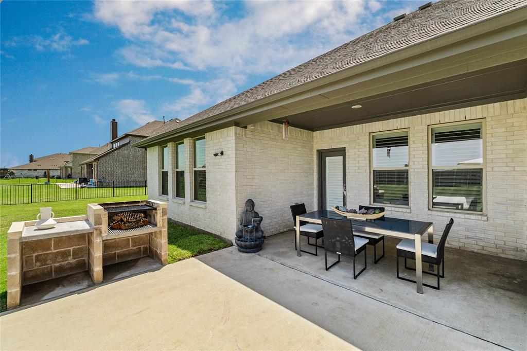 1430 Shaker Hills Road Gunter, TX 75058 - Photo 25 of 32 a outdoor space with patio furniture and a potted plant