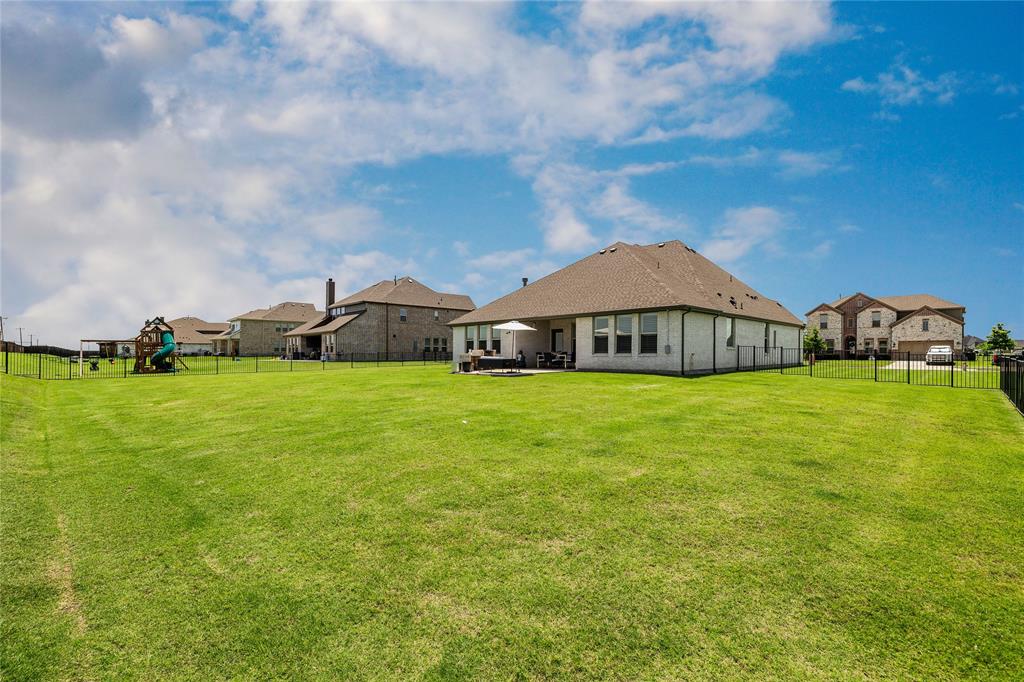1430 Shaker Hills Road Gunter, TX 75058 - Photo 29 of 32 a front view of a house with garden