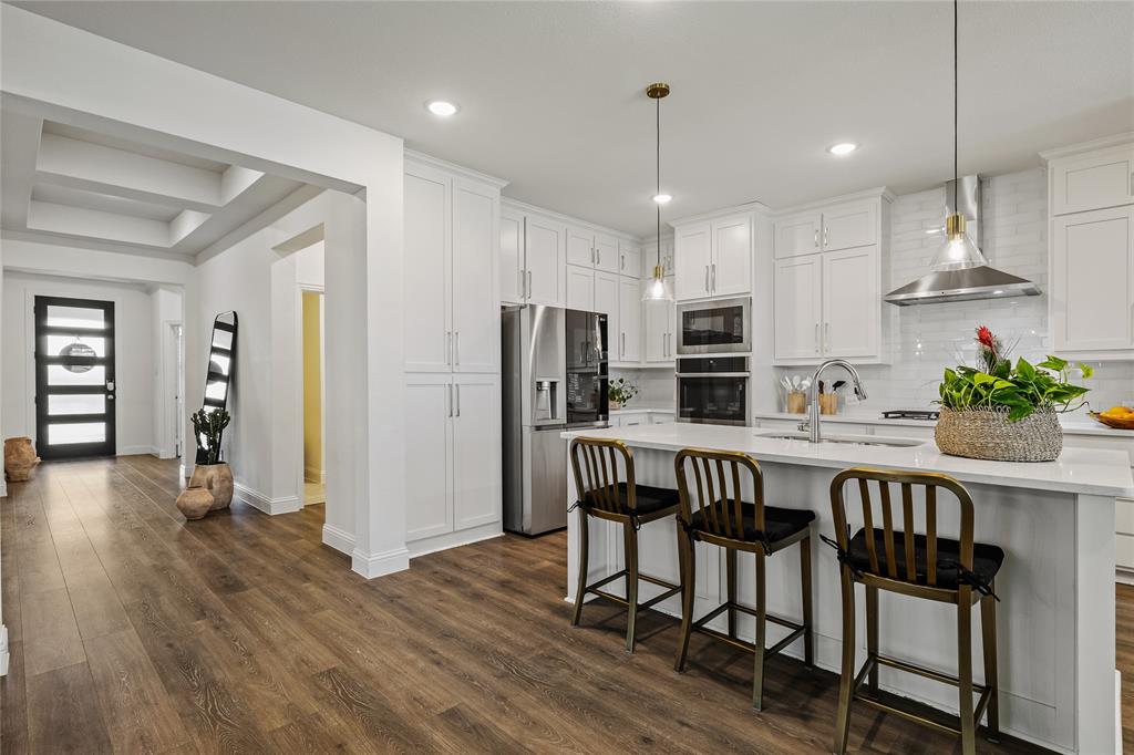 1430 Shaker Hills Road Gunter, TX 75058 - Photo 5 of 32 a view of kitchen with refrigerator and wooden floor