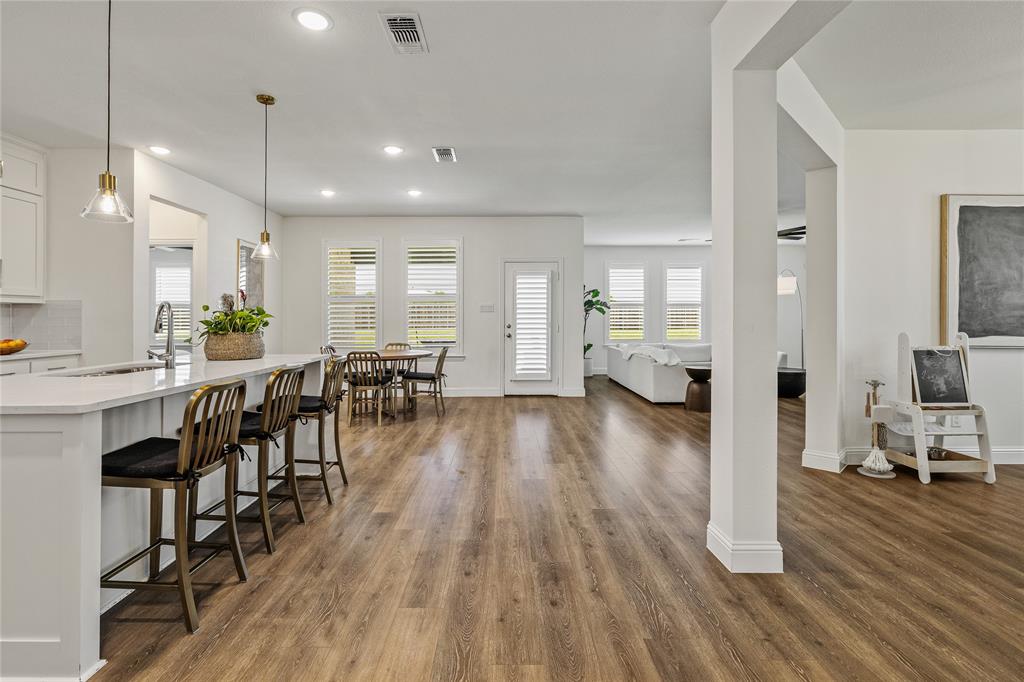 1430 Shaker Hills Road Gunter, TX 75058 - Photo 6 of 32 a view of a dining room with furniture wooden floor and chandelier