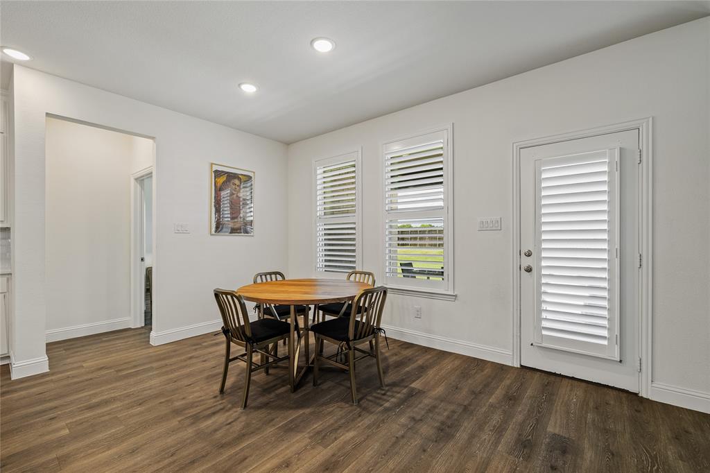 1430 Shaker Hills Road Gunter, TX 75058 - Photo 8 of 32 a view of a dining room with furniture and wooden floor