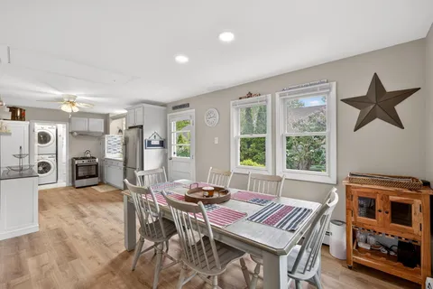 a view of a dining room with furniture window and outside view