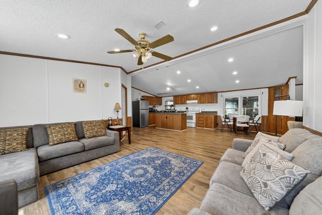 a living room with furniture rug and window