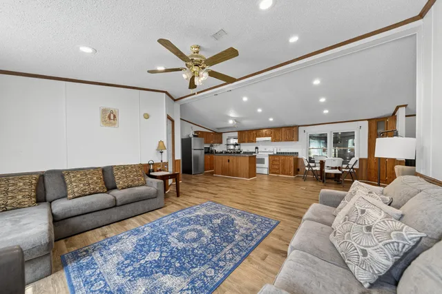 a living room with furniture rug and window