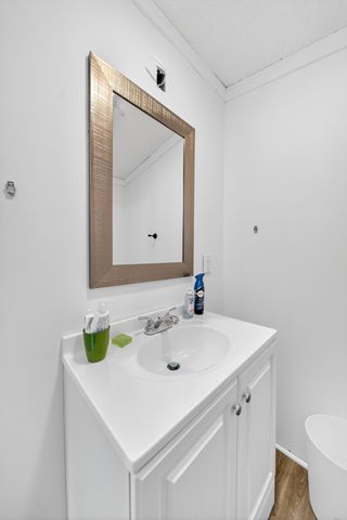 a bedroom with a bed lamp and a window