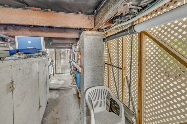 a bedroom with furniture and a mirror