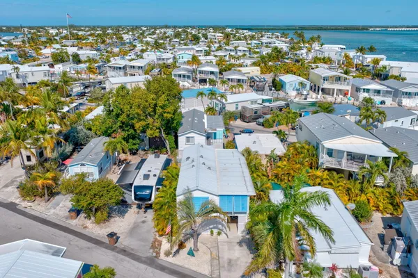 an aerial view of residential house with outdoor space and street view