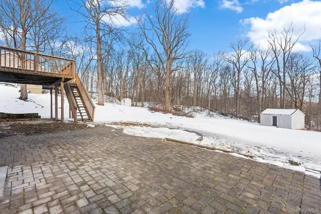 a view of a house with a snow on the road
