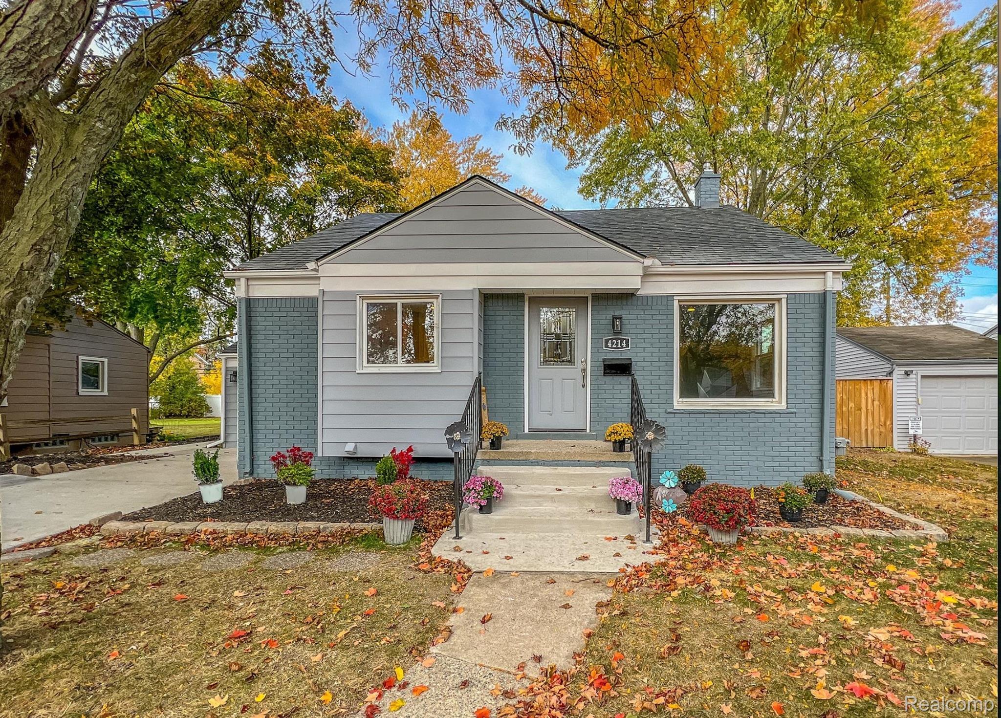 4214 Berkshire Road Royal Oak, MI 48073 - Photo 1 of 27 Crafted residence featuring a combination of brick and siding exterior, a front entry with handrails, and a paved walkway