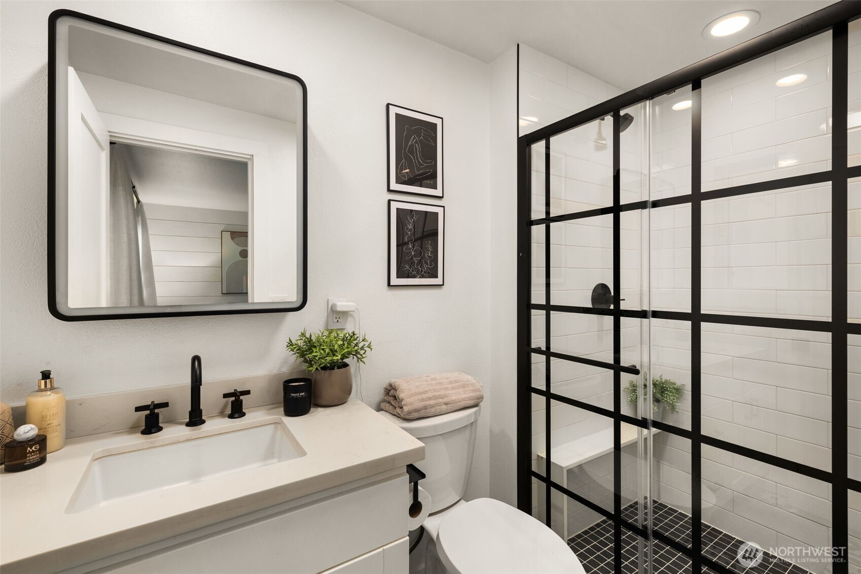 9417 235th Place Southwest Edmonds, WA 98020 - Photo 14 of 30 a bathroom with a sink toilet and mirror