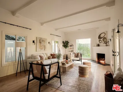 a view of a dining room with furniture and a mirror