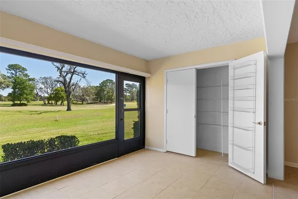 a kitchen with granite countertop cabinets stainless steel appliances and a counter space