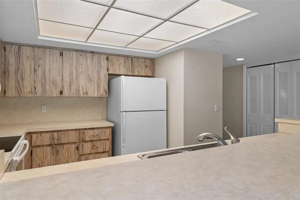 a kitchen with a sink cabinets and window