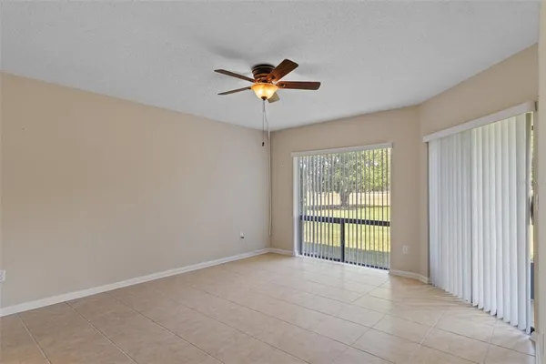 a bathroom with a granite countertop sink and mirror with bathtub