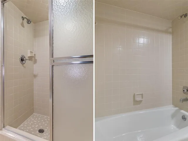 a bathroom with a bathtub and a shower