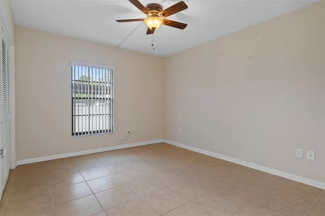 a view of a swimming pool with a bench in the patio
