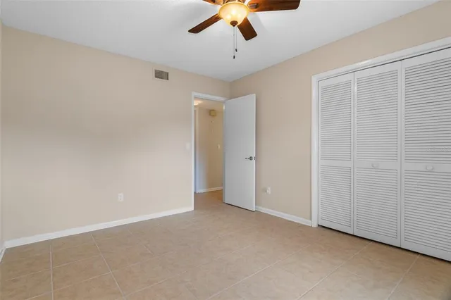 a view of a park with a large trees