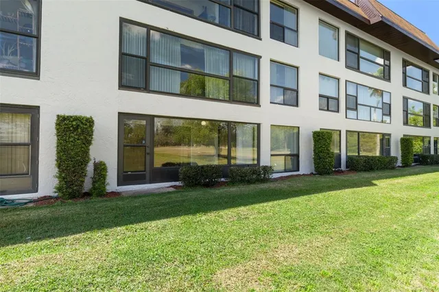 a view of a swimming pool with a yard