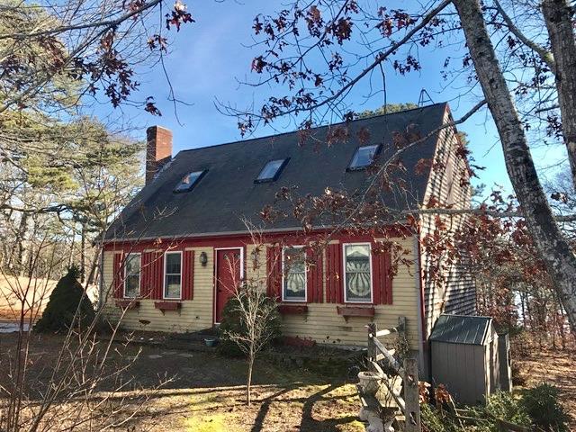 60 Ridge St Extension Wellfleet, MA 02667 - Photo 1 of 21 a front view of a house with parking area