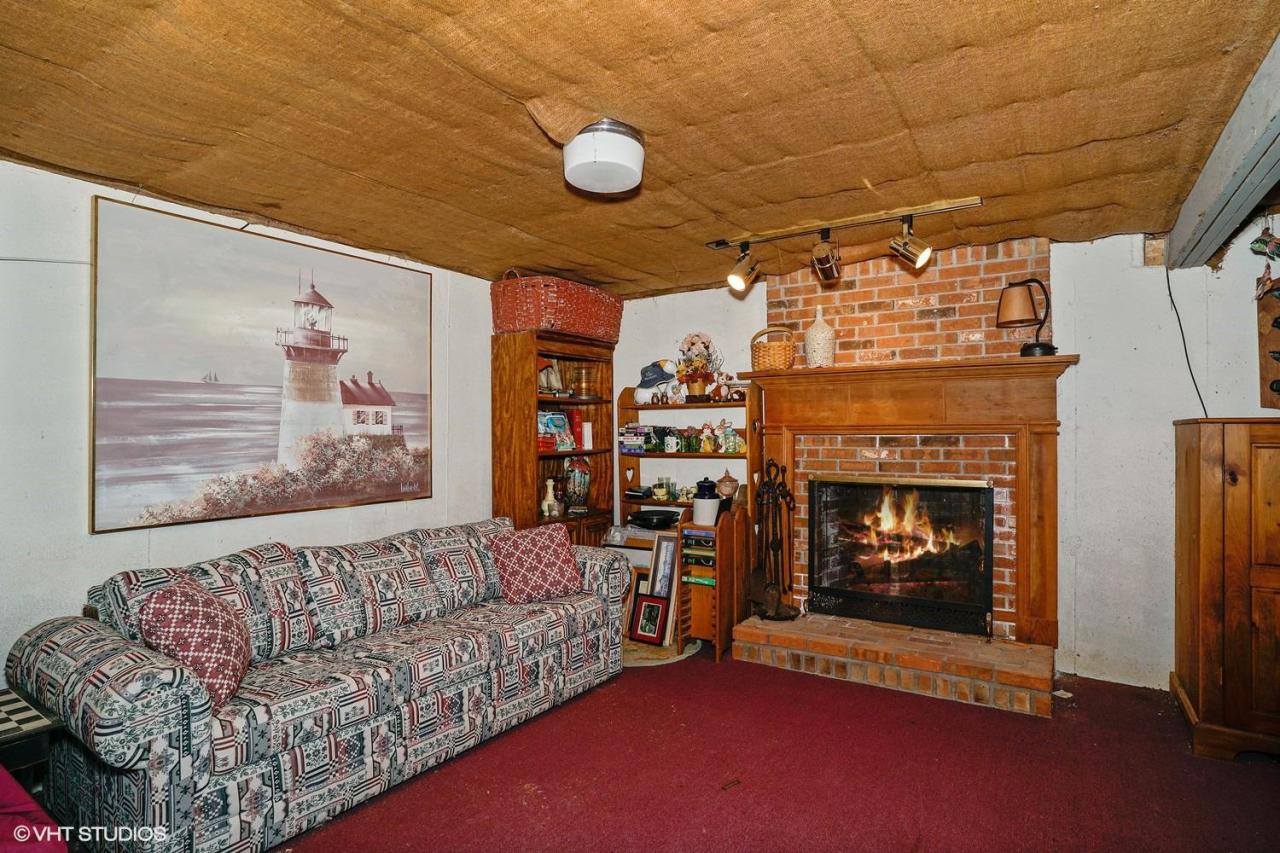 60 Ridge St Extension Wellfleet, MA 02667 - Photo 11 of 21 a living room with furniture and a fireplace