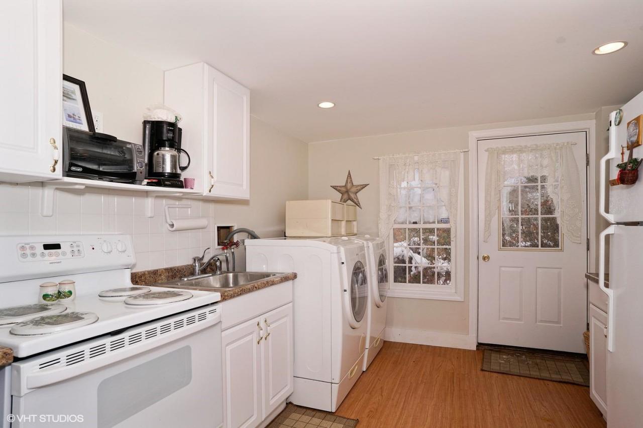 60 Ridge St Extension Wellfleet, MA 02667 - Photo 12 of 21 a kitchen with a sink cabinets and wooden floor