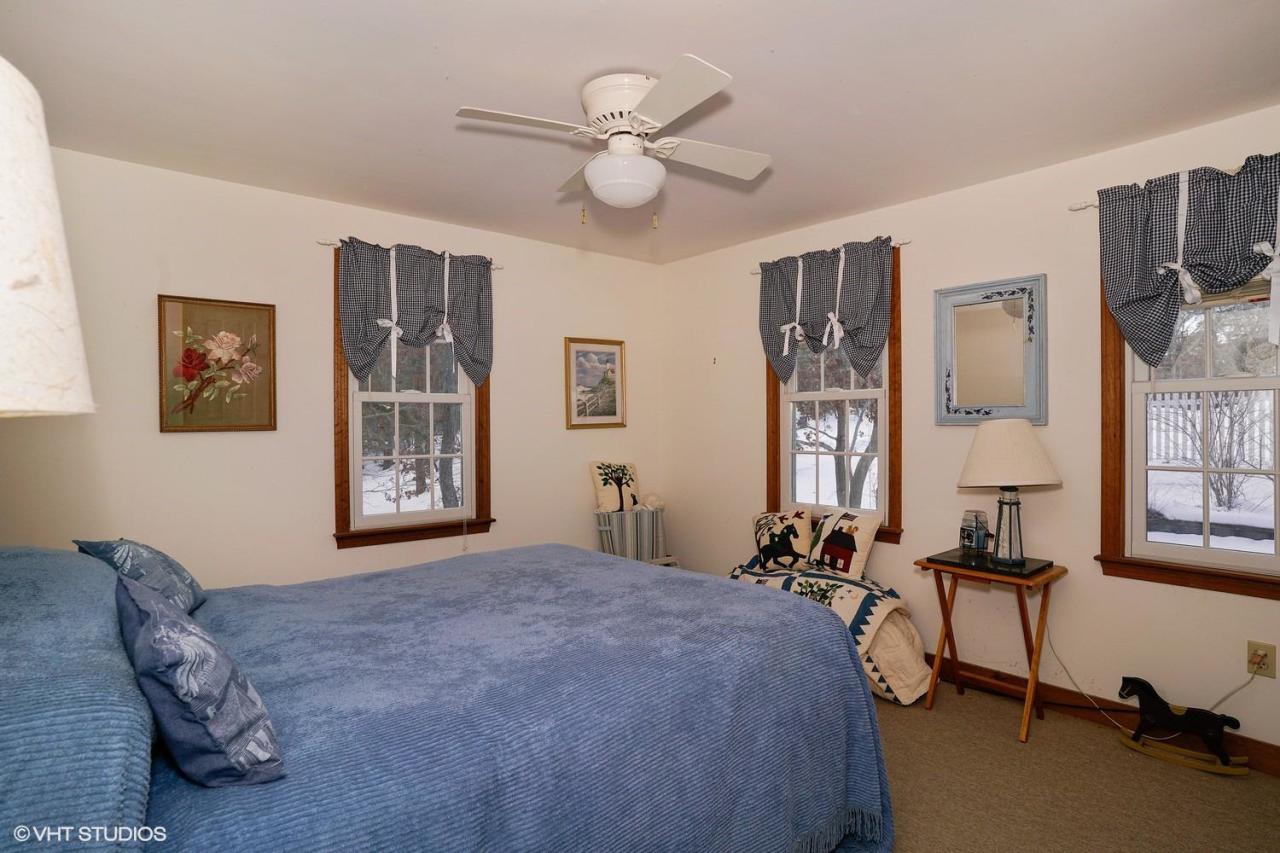 60 Ridge St Extension Wellfleet, MA 02667 - Photo 13 of 21 a bed room with a bed and a chandelier