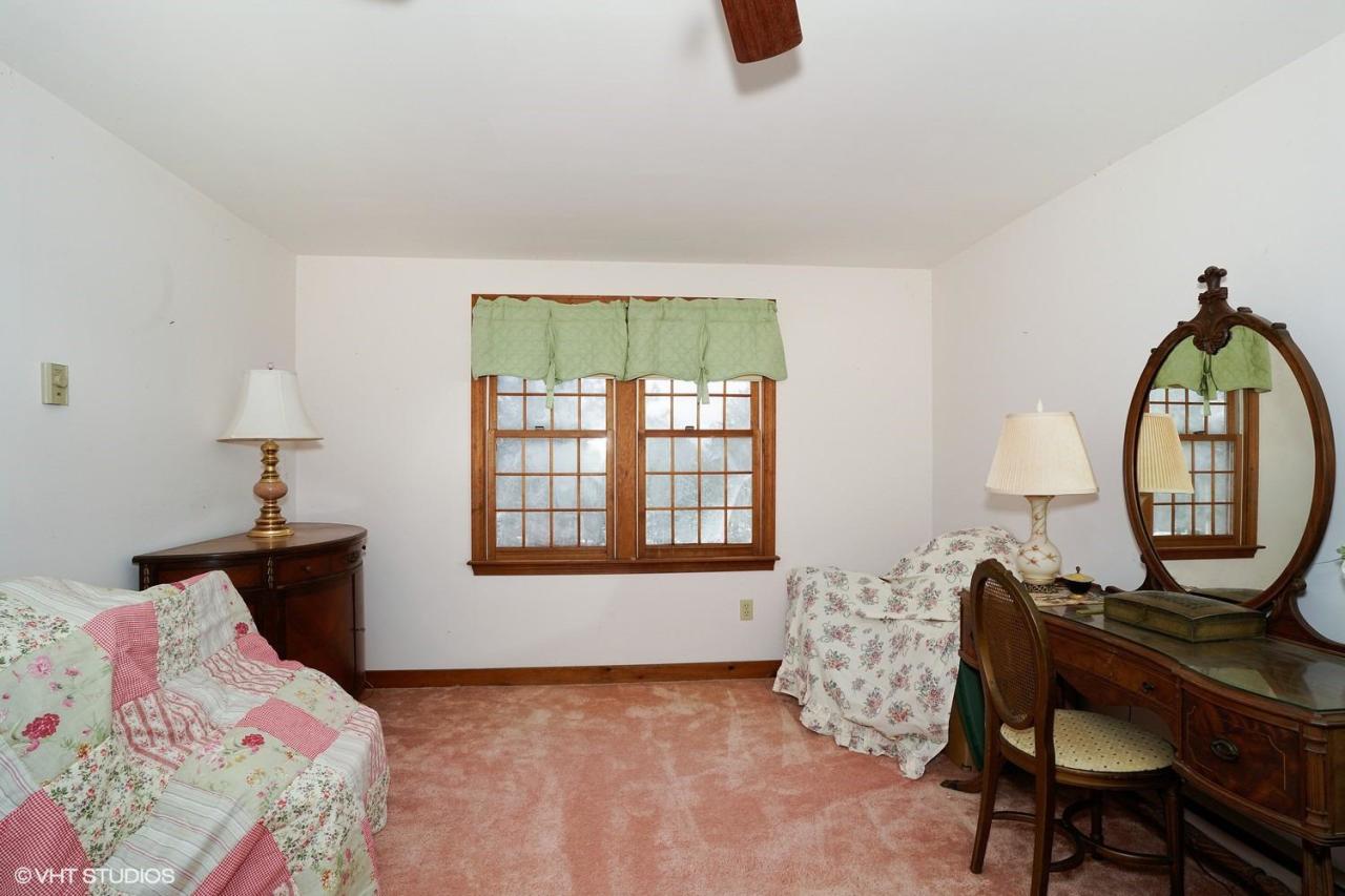 60 Ridge St Extension Wellfleet, MA 02667 - Photo 18 of 21 a bedroom with a bed a dresser and a window