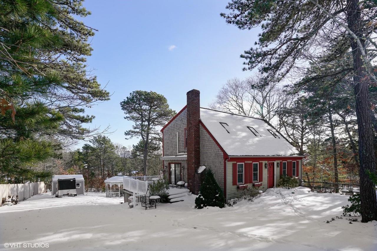 60 Ridge St Extension Wellfleet, MA 02667 - Photo 20 of 21 a view of a building with a bench in the patio