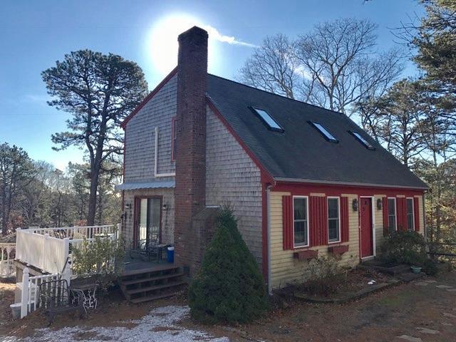 60 Ridge St Extension Wellfleet, MA 02667 - Photo 2 of 21 a front view of a house with garden
