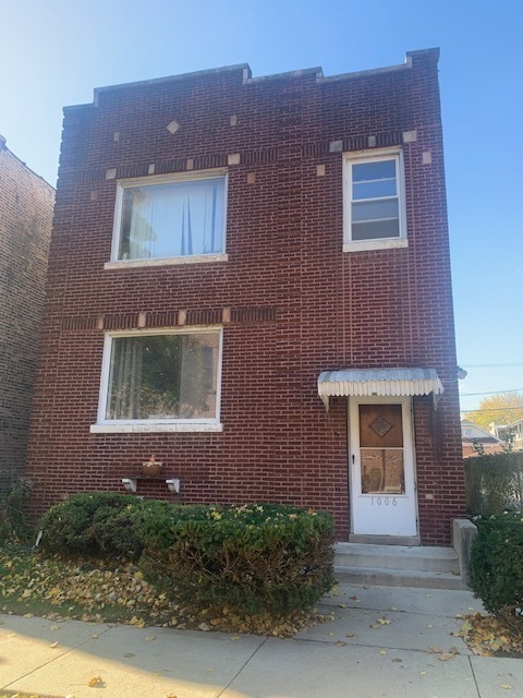 1006 South Menard Avenue, Unit 2 Chicago, IL 60644 - Photo 1 of 8 a front view of a house
