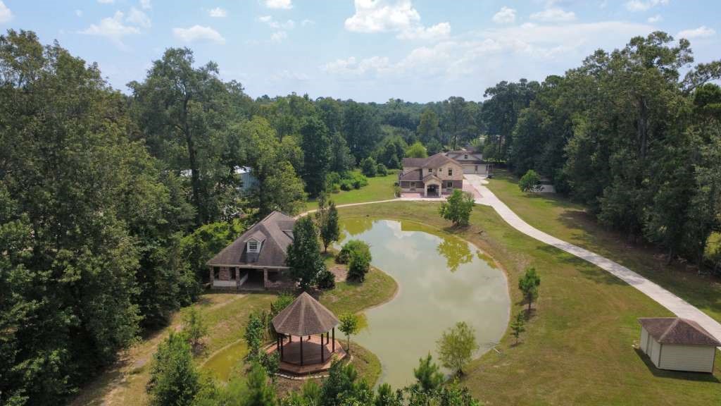 11529 Warner Road Cleveland, TX 77328 - Photo 1 of 27 an aerial view of a house with pool