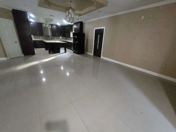 a view of an empty room with a fireplace