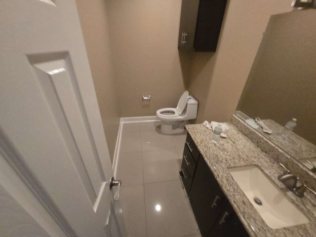 11529 Warner Road Cleveland, TX 77328 - Photo 15 of 27 a bathroom with a granite countertop sink toilet and shower