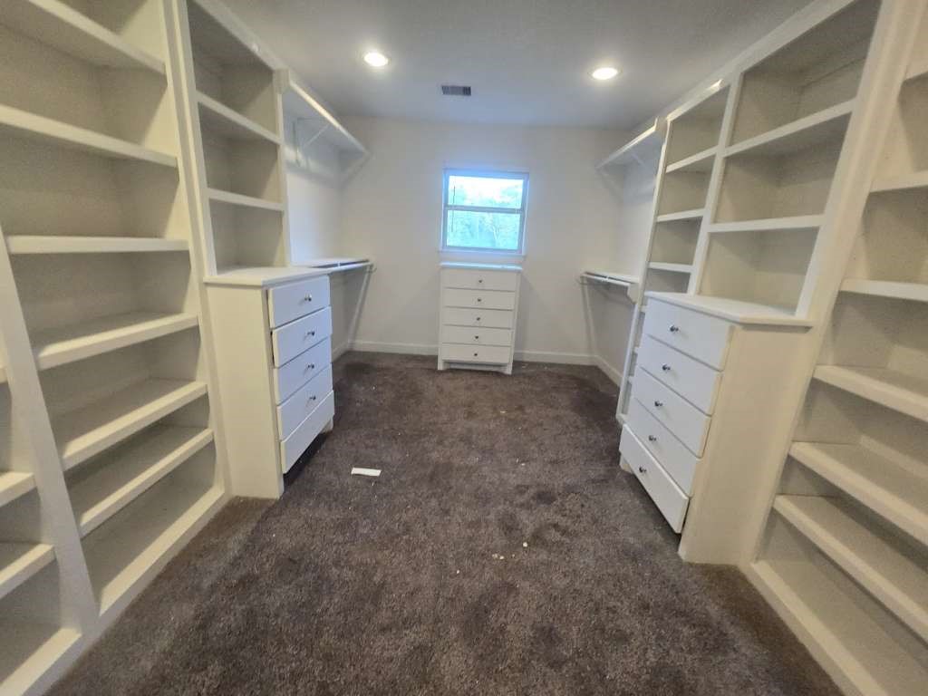 11529 Warner Road Cleveland, TX 77328 - Photo 19 of 27 a view of an empty walk in closet