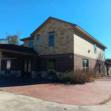 a front view of a house with yard