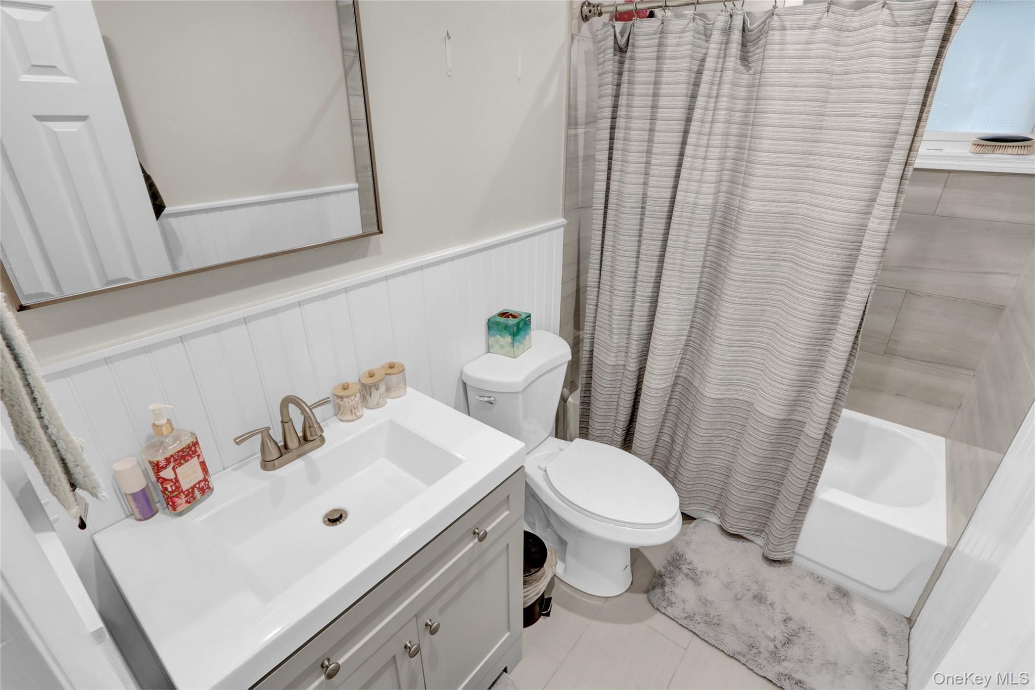 220 East Chester Street Long Beach, NY 11561 - Photo 11 of 26 a bathroom with a sink and toilet