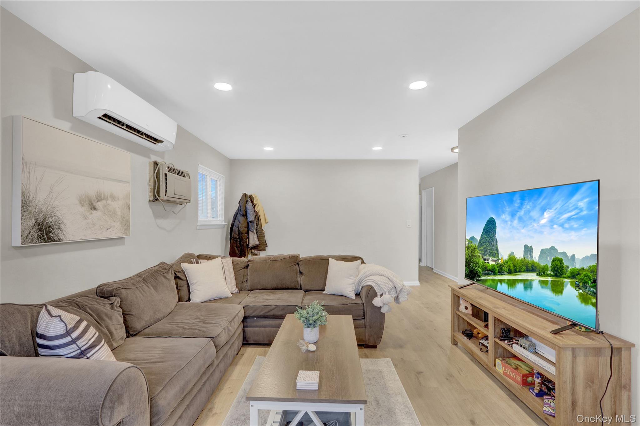 220 East Chester Street Long Beach, NY 11561 - Photo 12 of 26 a living room with furniture and a flat screen tv