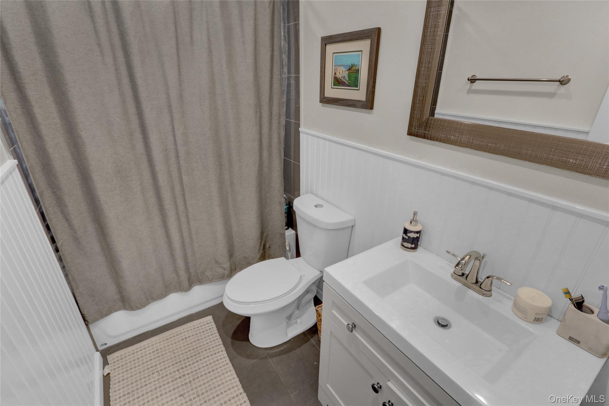 220 East Chester Street Long Beach, NY 11561 - Photo 16 of 26 a bathroom with a sink and a toilet